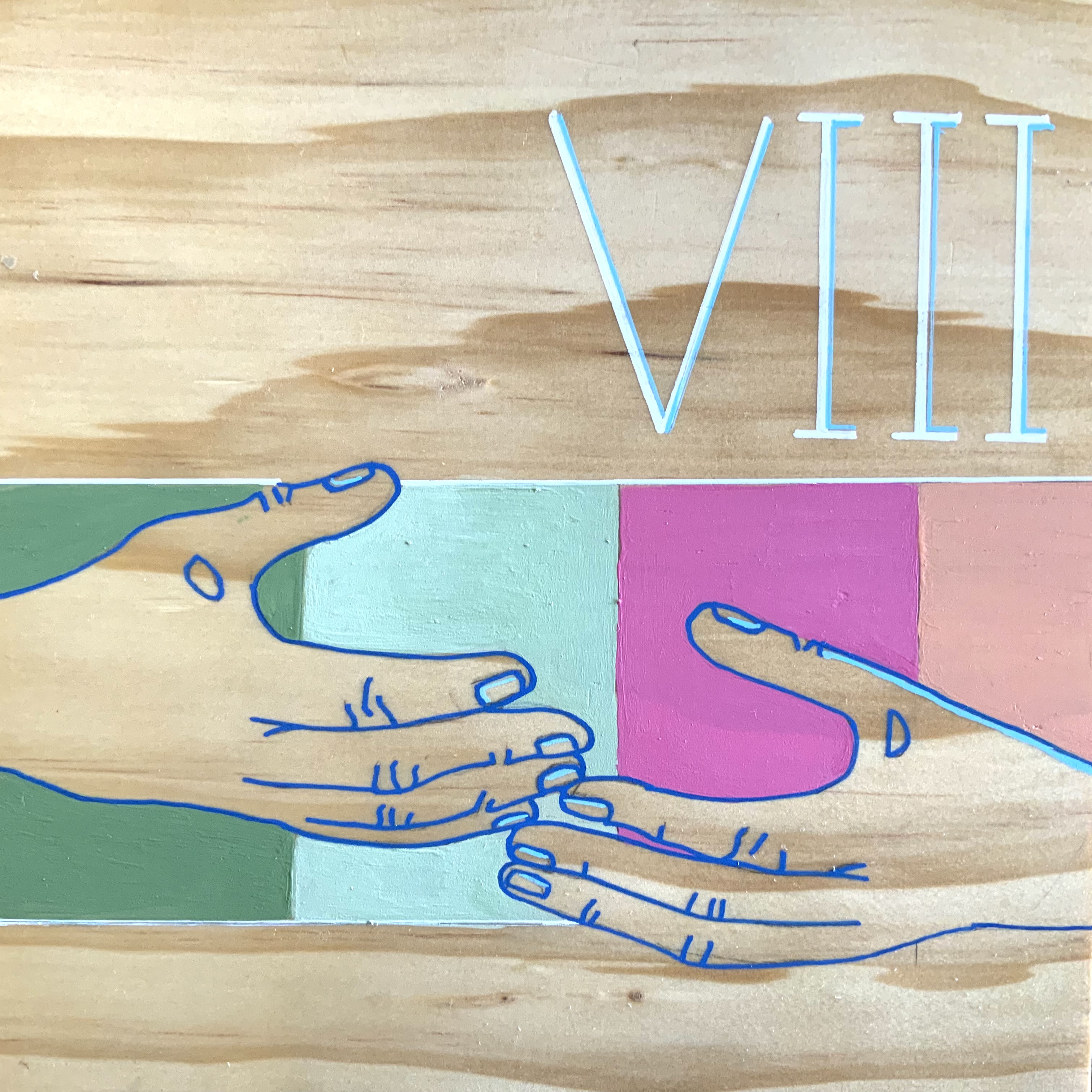 Illustrated mural showing two outlined hands interacting, with the Roman numeral “VIII” displayed above.