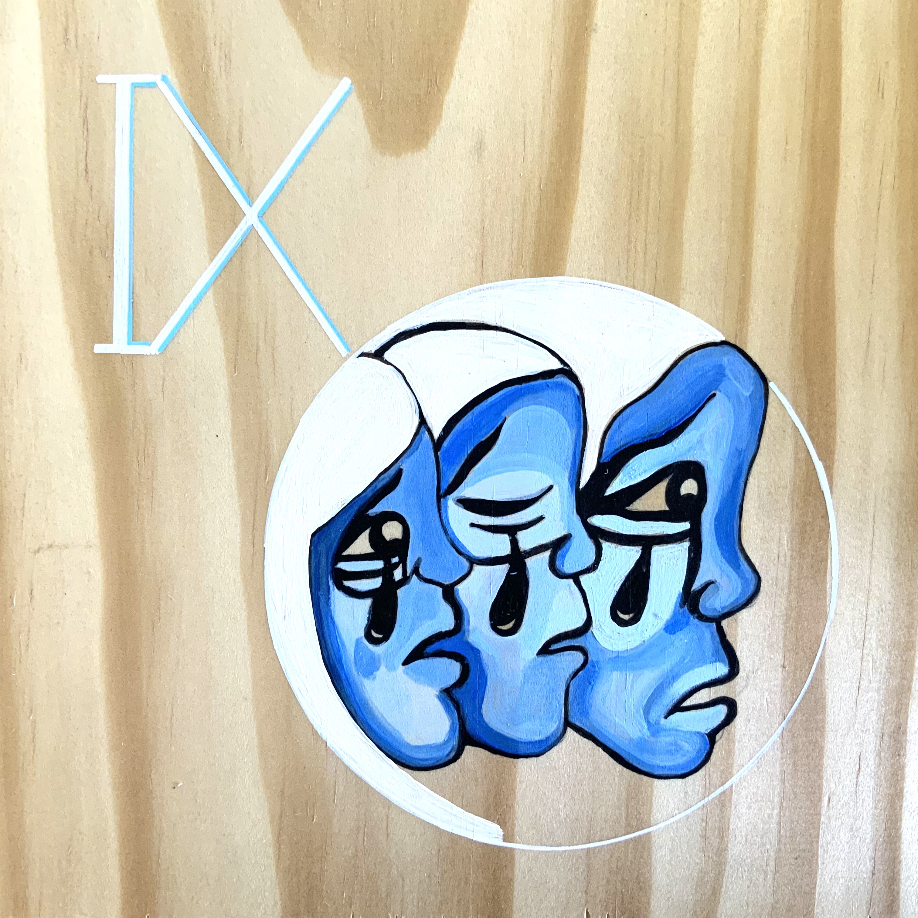 Illustrated mural of three blue faces with tear shapes, with the Roman numeral “IX” displayed beside them.